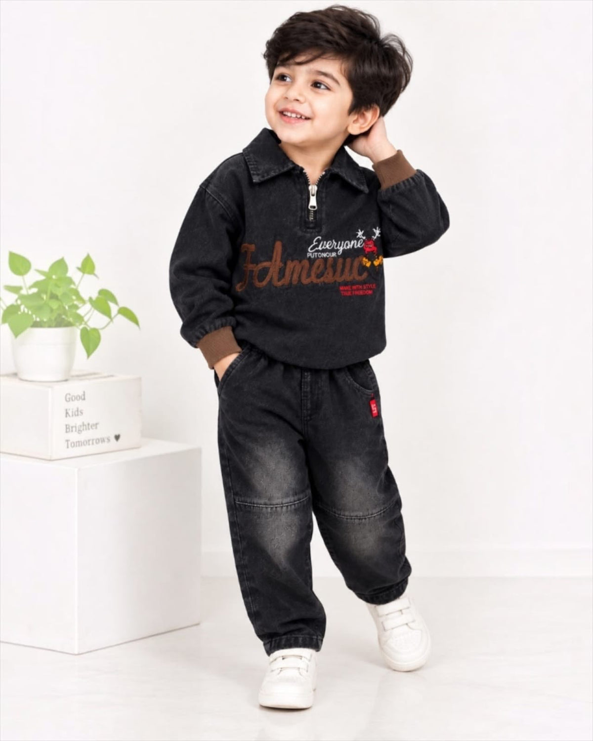 Boy wearing black embroidered denim co-ord set